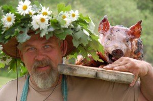 The master roaster himself parades the day's work to the dinner table. 